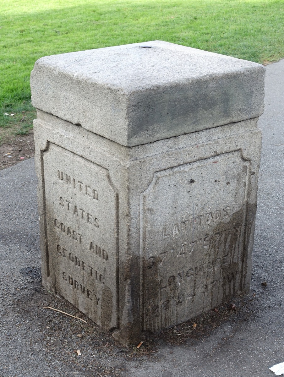 A brass US Coast and Geodetic Survey disk set into pavement in Washington Square, San Francisco
